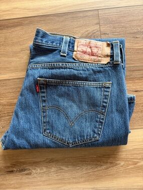 Levi's Men's Straight Denim Jeans in Blue with Tan Patch